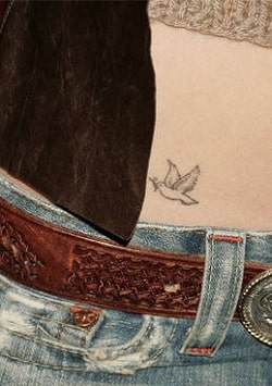 A picture of Dove tattoo on Jessica Biel's hip.